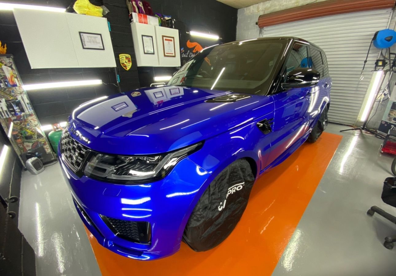 Orange garage floor with blue car